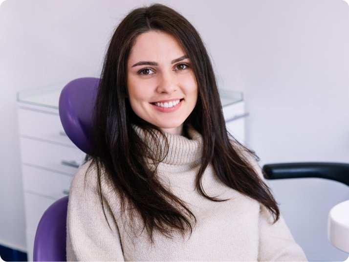 Patient smile with dental bridges in Mold