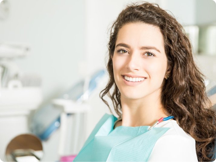 Patient smile after dental fillings in Mold