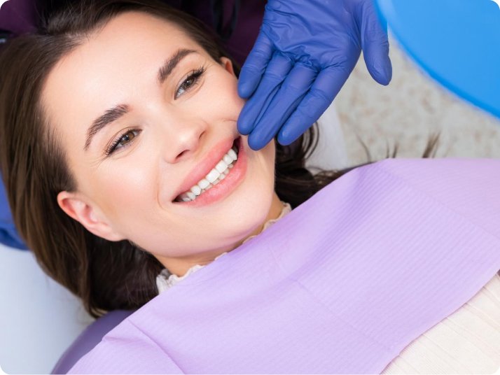 Patient smile after root canal treatment in Mold