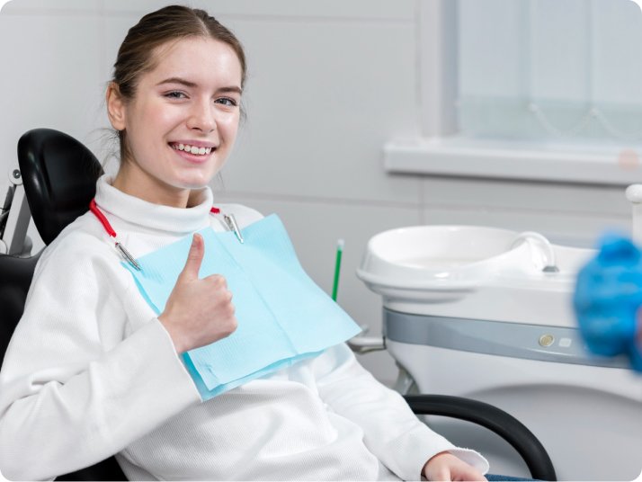 Patient smile after tooth extraction treatment in Mold